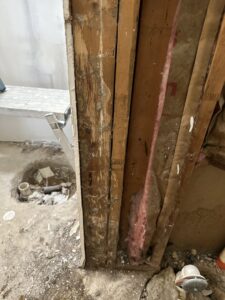 Damaged wooden beams, likely from termite activity, exposed during an inspection or treatment by Next Level Pest Services in Fort Worth, TX.