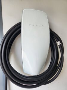 A Tesla electric vehicle charging station installed on a wall by ALC Electric LLC in Goose Creek, SC