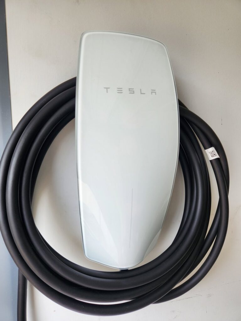 A Tesla electric vehicle charging station installed on a wall by ALC Electric LLC in Goose Creek, SC