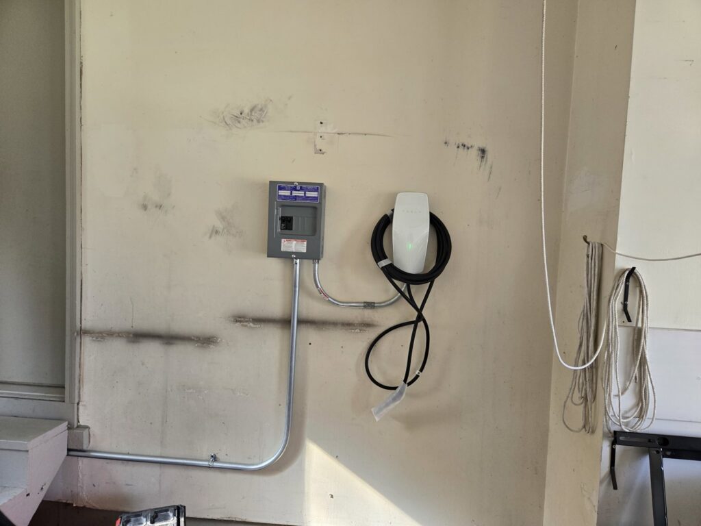 Tesla EV charger and dedicated electrical panel installation by JAL Electrical Construction in Hammond, IN.
