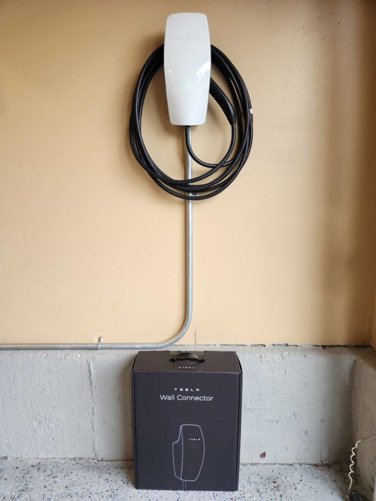 A Tesla Wall Connector EV charger professionally installed by Square Electrical LLC in Alexandria, VA, ready for electric vehicle charging.