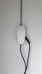A Tesla electric vehicle charger professionally installed on a wall by The Wire Guy in San Jose, CA.