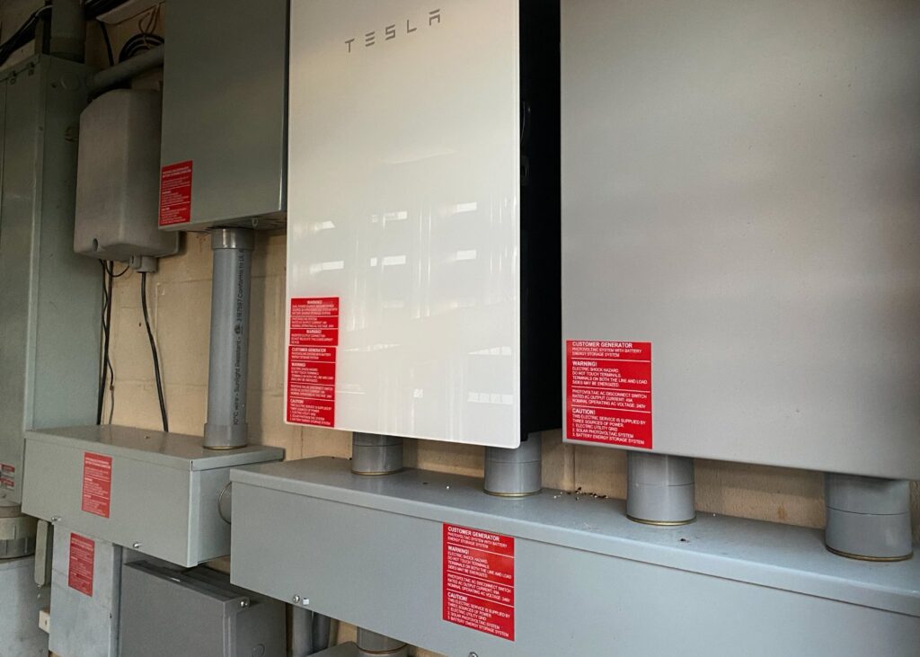 Tesla Powerwall battery storage system and electrical panels installed by Alternate Energy Inc. in Pearl City, HI.