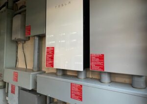 Tesla Powerwall battery storage system and electrical panels installed by Alternate Energy Inc. in Pearl City, HI.