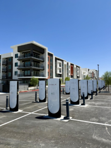 Newly installed Tesla Supercharger stations in a parking lot by Foxtrot Electric in Las Vegas, NV