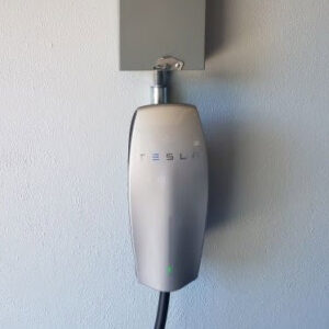 A close-up of a Tesla Wall Connector EV charger, professionally installed by Smith Electrical Contractors, Inc. in El Cajon, CA.