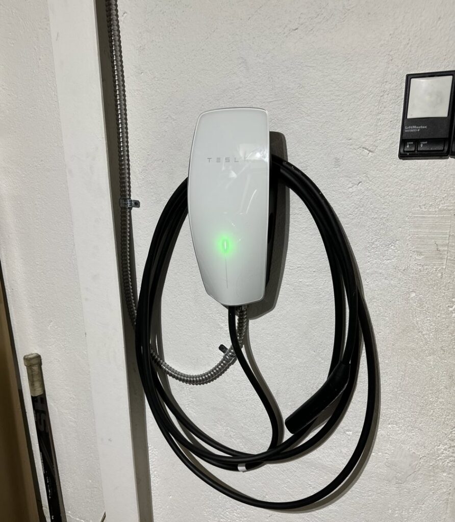A Tesla wall connector professionally installed by ChargerPro in Denver, CO.