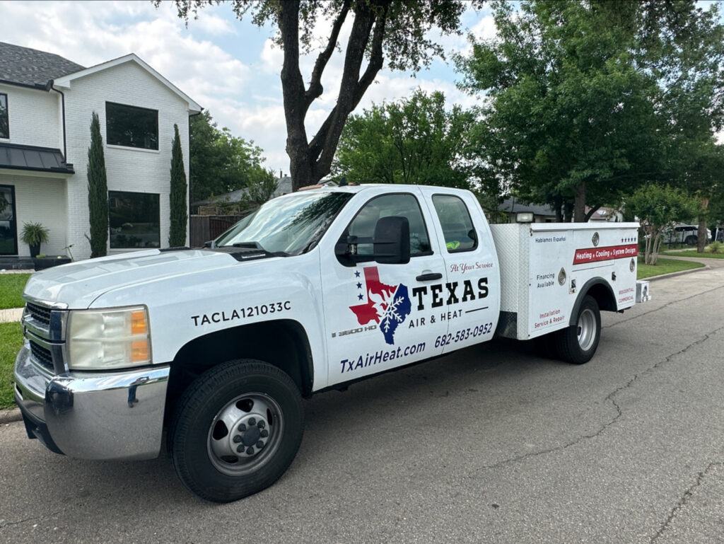 A Texas Air & Heat service truck parked on a residential street, ready for HVAC jobs in Arlington, TX.