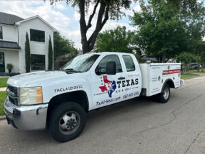 A Texas Air & Heat service truck parked on a residential street, ready for HVAC jobs in Arlington, TX.