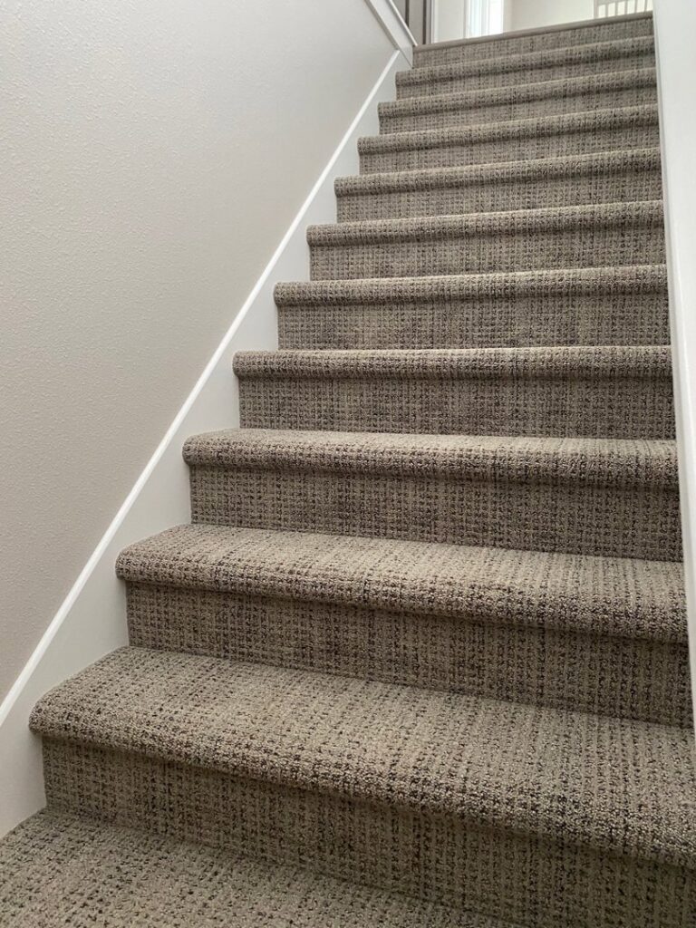Professionally installed textured carpet on a staircase by Independent Flooring in Eau Claire, WI