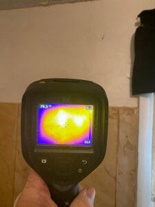 A thermal imaging camera being used to locate a hidden bee hive by Dale Richter's The Buzz Fuzz in Leesburg, GA