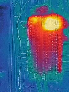 A thermal image of an electrical panel showing hot spots, used for diagnostic inspection by Eon Electric in Orem, UT.