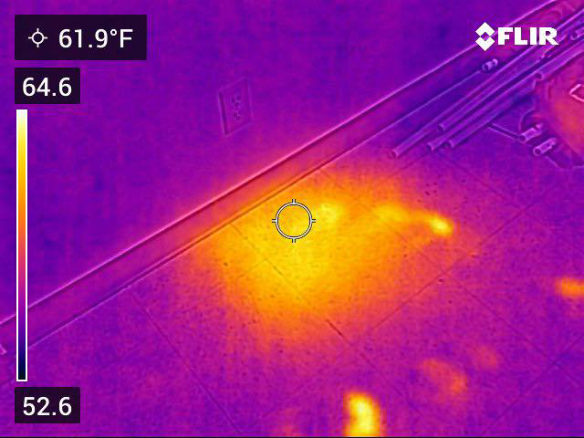 A thermal scan showing a hot spot on a floor, indicating a hidden bee nest, by A&E Bee Extraction and Control in Mount Pleasant, SC.