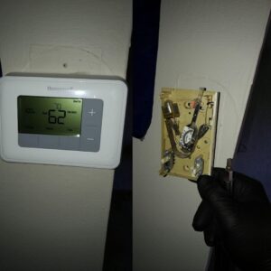 Before and after image of a thermostat replacement and installation by Wilcox Services in Temple Hills, MD.
