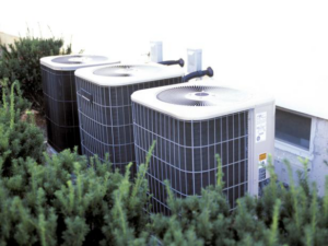 Three outdoor HVAC condenser units installed by Cool Concepts A/C & Heating in San Antonio, TX.
