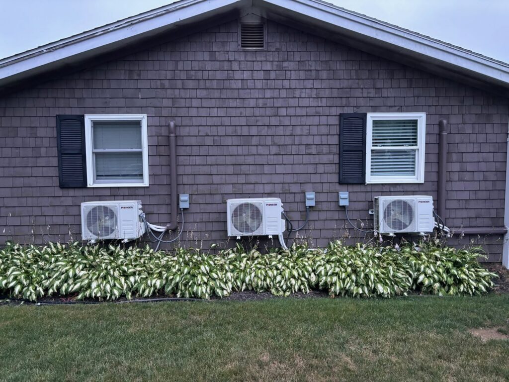 Three outdoor mini-split HVAC condenser units professionally installed by A&A Mechanical HVAC in Raynham, MA.