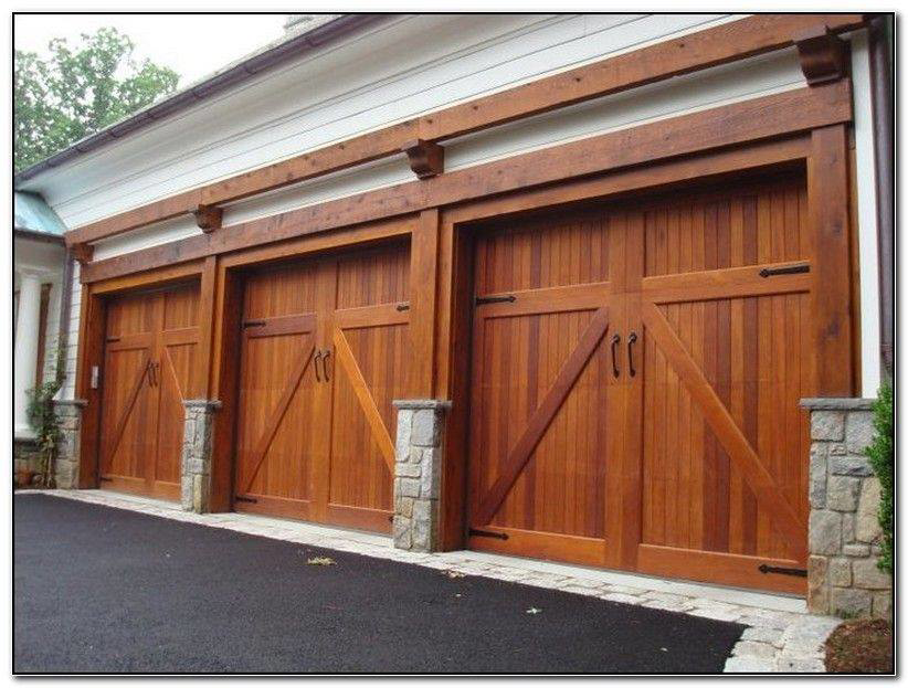 Three newly installed custom wooden garage doors by Garage Door Repair Kenosha WI in Kenosha, WI.