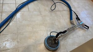 A rotary tool and hose used for professional tile and grout cleaning by Jason Lostetter Carpet Cleaning in New Glarus, WI.