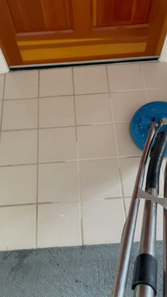 A tile floor being professionally scrubbed and cleaned by Radiant Rugs Carpet Cleaning in Spokane, WA.