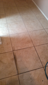 Tile and grout cleaning in progress, showing a clean section and a dirty section, by A Copesetic Carpet, Upholstery, Tile & Grout Cleaner in Mesa, AZ