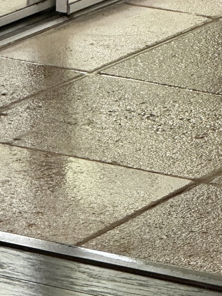 Tile and grout cleaning in progress, showing wet tiles, by Captain Steamer in Cape Coral, FL.