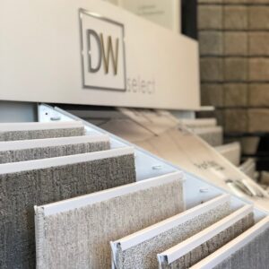 Various tile samples displayed on a wall in the Carpet USA showroom in Vancouver, WA.