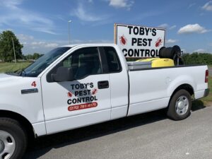 A Toby's Pest Control truck with a sprayer tank and equipment in the bed, ready for service in Bowling Green, KY.