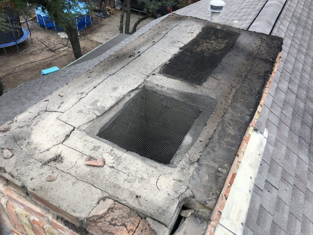 The top of a chimney with mesh covers, showing wear, indicating inspection or repair by HBR Hearth and Chimney in Dallas, TX