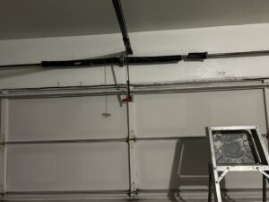 A close-up view of a garage door torsion spring system, ready for replacement by SS Garage Door Repair in Denver, CO.