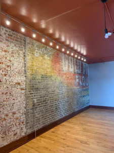 Track lighting and exposed wiring installed in a commercial space by Crown Enterprises Electrical Contracting in Omaha, NE.