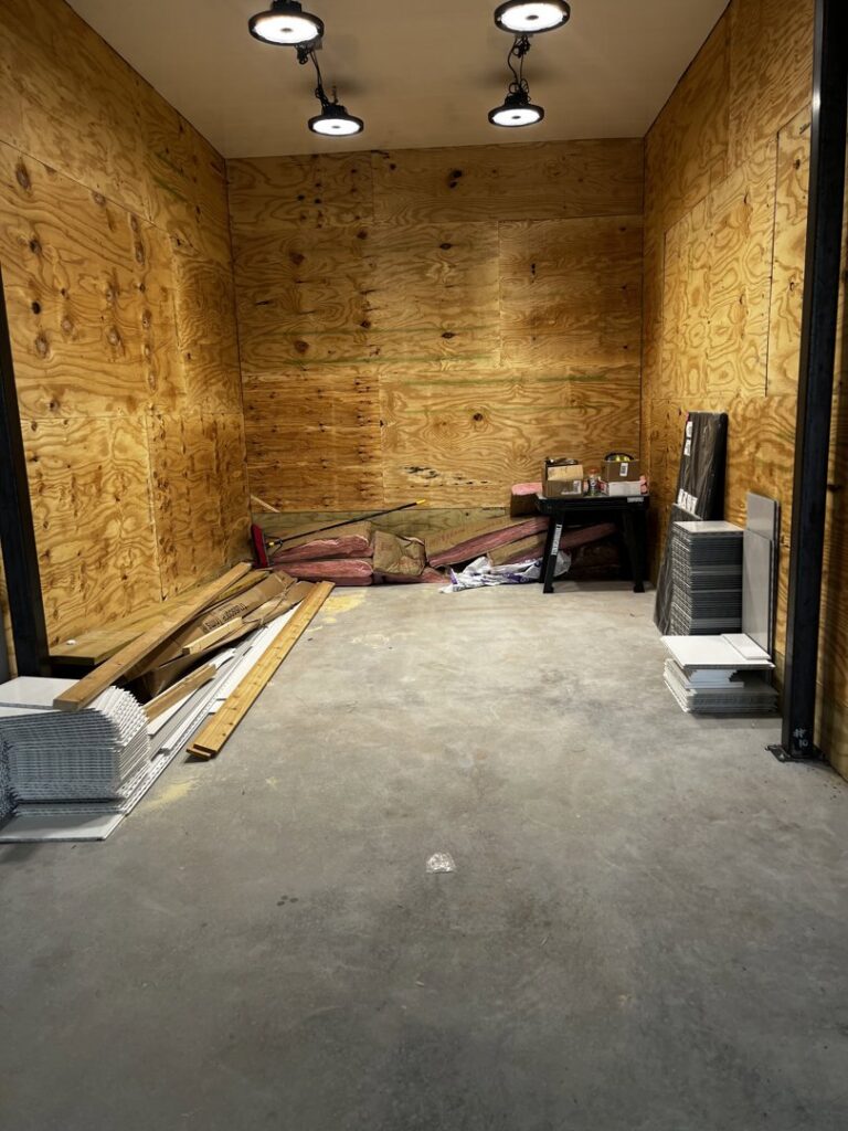 Track lighting fixtures installed on the ceiling of a room under construction, a service provided by Superior Electrical Solutions llc in Clear Spring, MD.