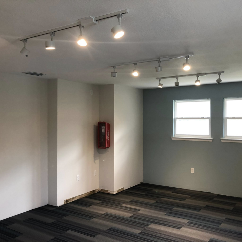 Newly installed track lighting illuminating a modern room by T.E.C Electrical Contracting, LLC in Jacksonville, FL