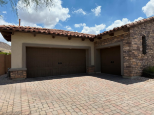 Traditional brown residential garage doors installed by Mr. Garage Door in Bell Gardens, CA.