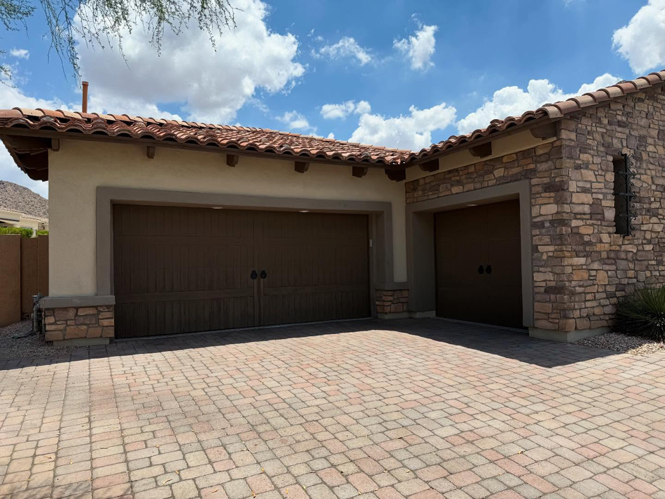 Traditional brown residential garage doors installed by Mr. Garage Door in Bell Gardens, CA.