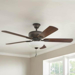 A traditional ceiling fan with dark wooden blades and a light kit installed by Jack-O-Lantern Electric in Knoxville, TN.