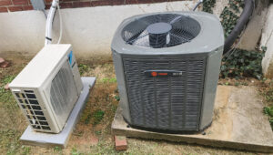 An outdoor Trane air conditioning unit and a Daikin mini-split outdoor unit installed by C&L Heating and Air in Louisville, KY.