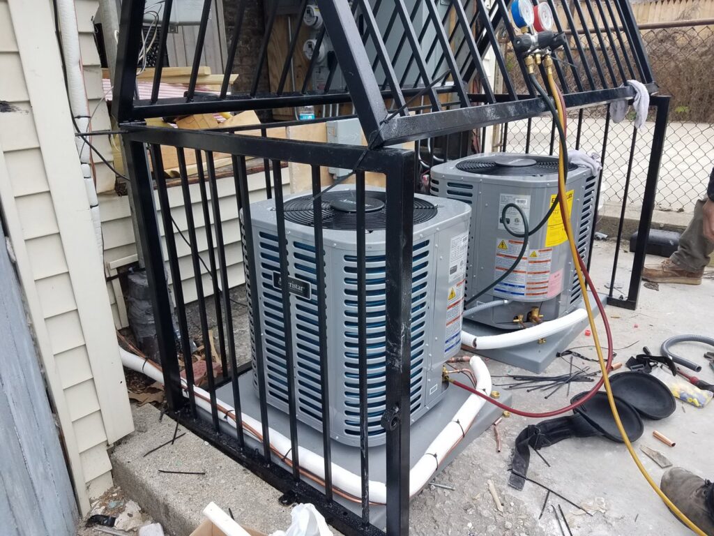 Two Trane air conditioning units being installed or serviced with gauges connected by Service Pro Titans in Chicago, IL.