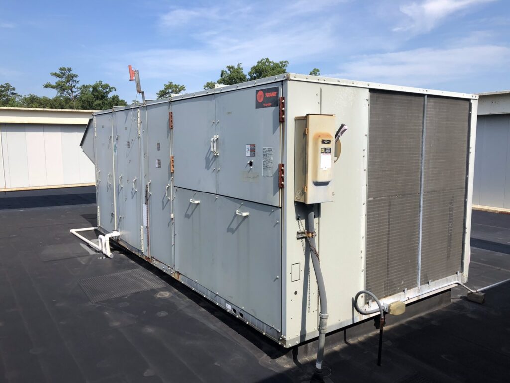 A large Trane commercial rooftop HVAC unit, serviced by Raleigh Comfort Services in Raleigh, NC.