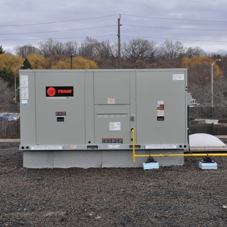 A large Trane commercial rooftop HVAC unit installed by PureTemp Heating and Cooling in Salem, NH.