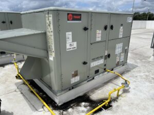 A large Trane commercial rooftop HVAC unit installed on a building by Underwood Heating and Air Conditioning in Phenix City, AL