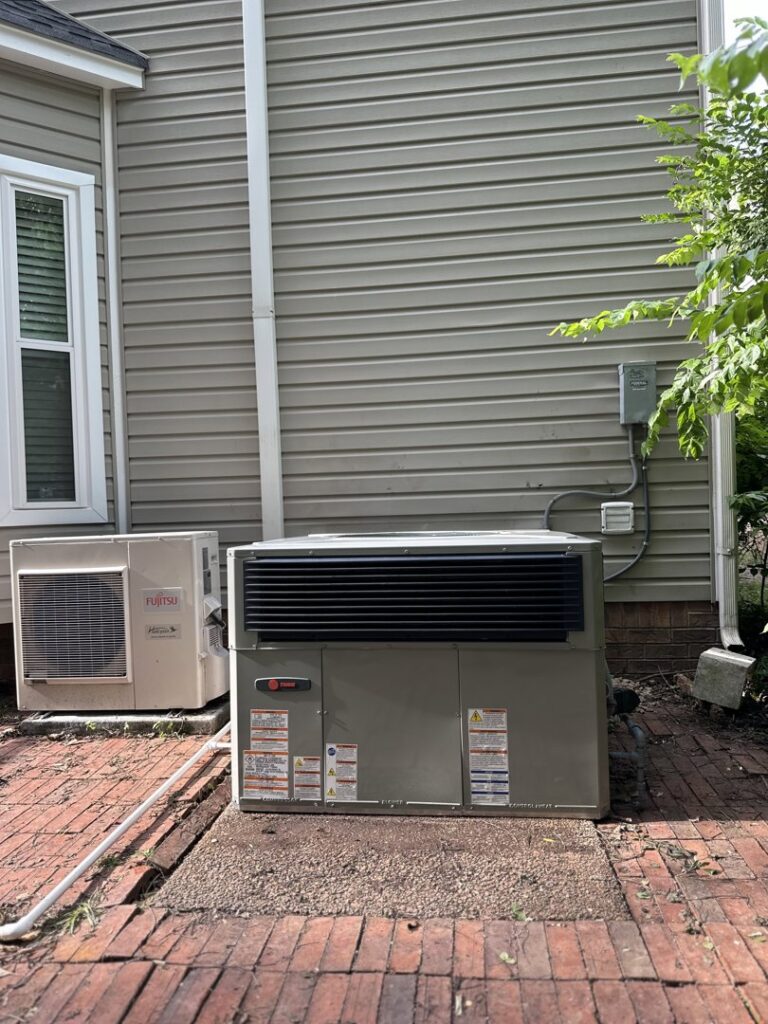 Two outdoor HVAC units, a Trane condenser and a Fujitsu mini-split, installed by Federal Heating & Cooling in Dresden, OH.