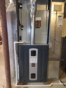 A Trane furnace and air handler unit with ductwork installed by Cosmic HVAC in Chicago, IL.