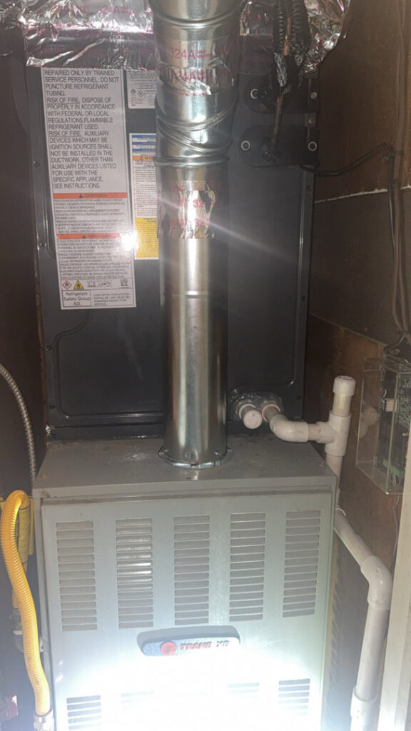A new Trane furnace and air handler unit with ductwork installed by AirTech Solutions LLC in Broken Arrow, OK.