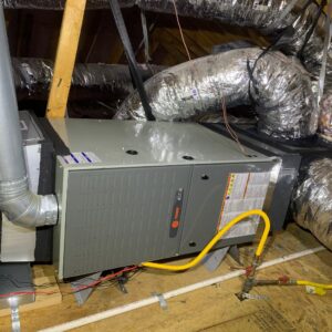 A Trane HVAC air handler unit with ductwork installed in an attic by EZ Comfort Air Conditioning & Heating LLC in Humble, TX.