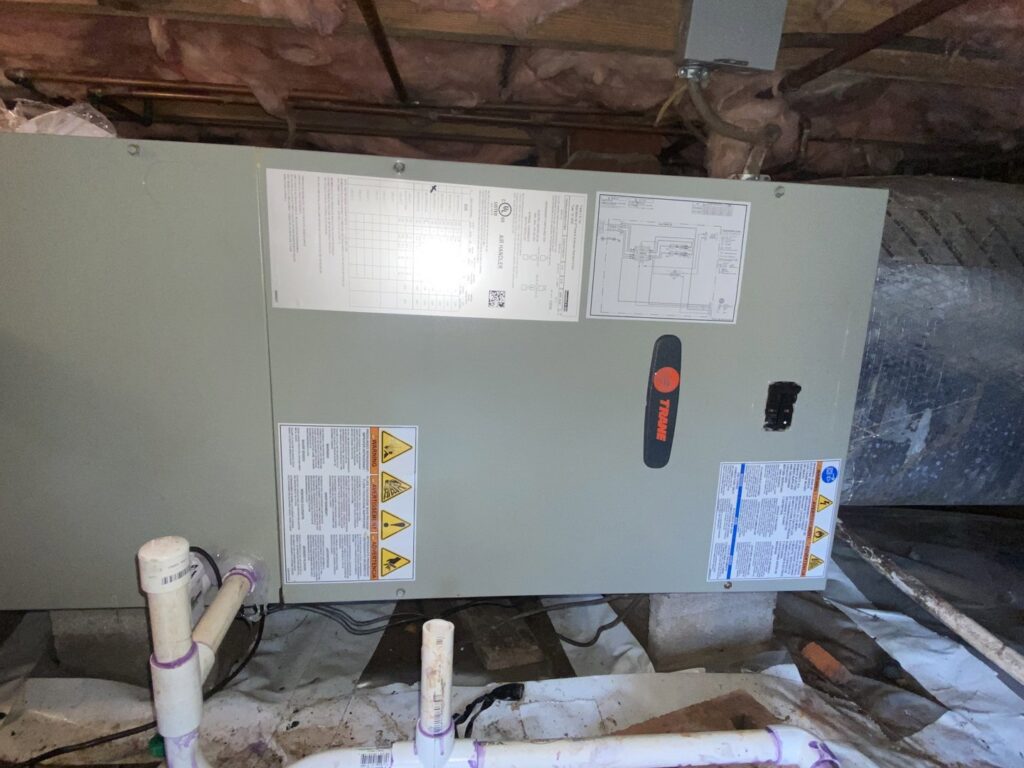 A Trane HVAC air handler unit installed in a crawl space by Subzero Mechanical LLC Heating & Air in Concord, NC.