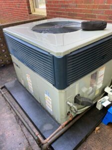 An outdoor Trane HVAC condenser unit installation by Integrity Services Heating and Cooling in Madison, AL.