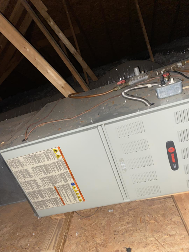 A Trane HVAC unit installed in an attic space by Fox Heating and Air service in Hueytown, AL.