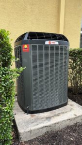 A Trane outdoor AC condenser unit installed by Southwest Florida Air Quality in Cape Coral, FL