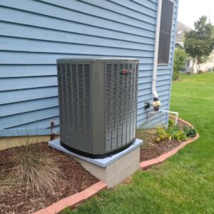 A Trane outdoor air conditioning unit installed next to a house by Cosmic HVAC in Chicago, IL.