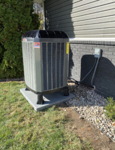 A newly installed Trane outdoor air conditioning unit by Roy Rogers Heating and Air in Indianapolis, IN.